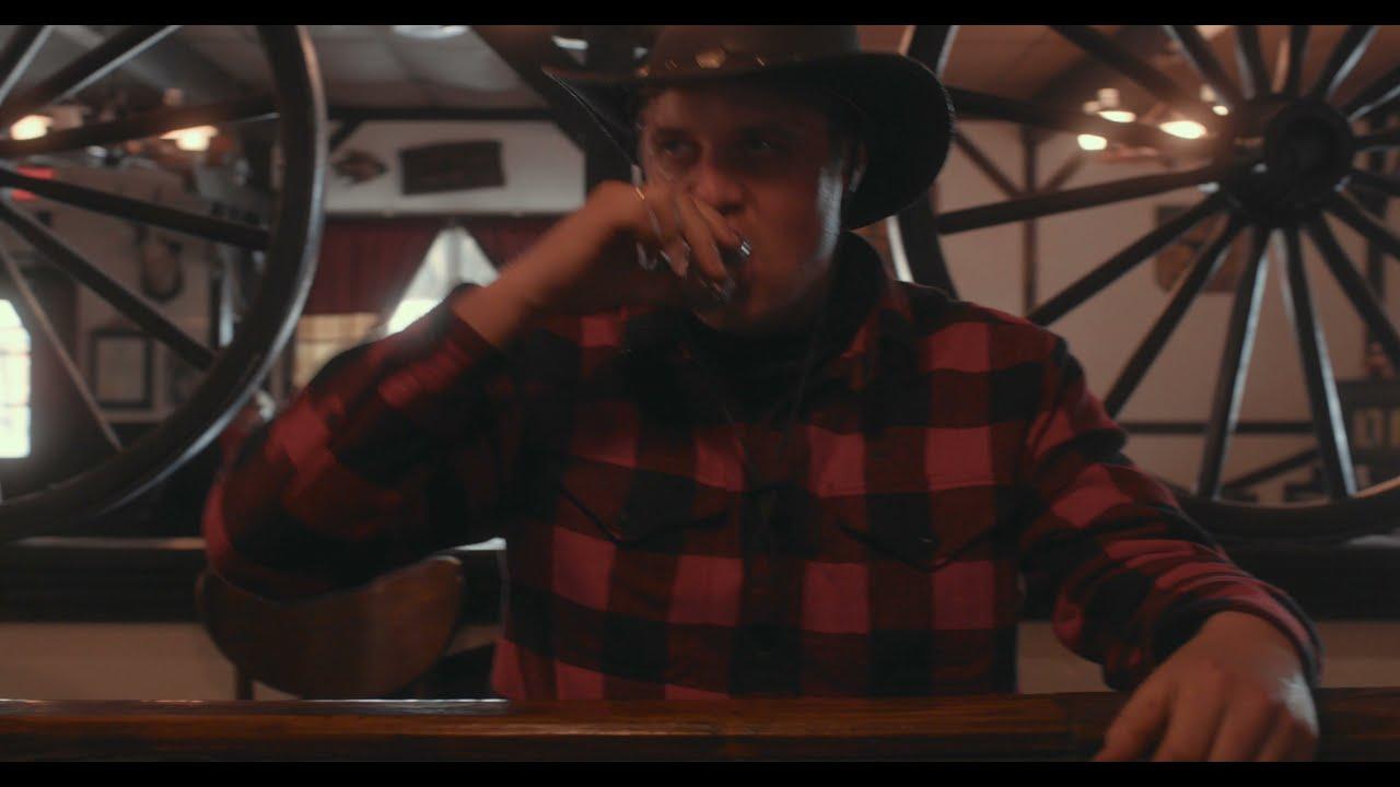 A costumed cast on the saloon set of a Western-themed commercial