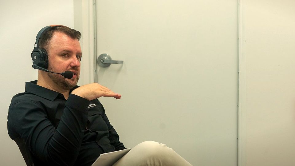 Slawomir Roszak directing on set, watching the monitor